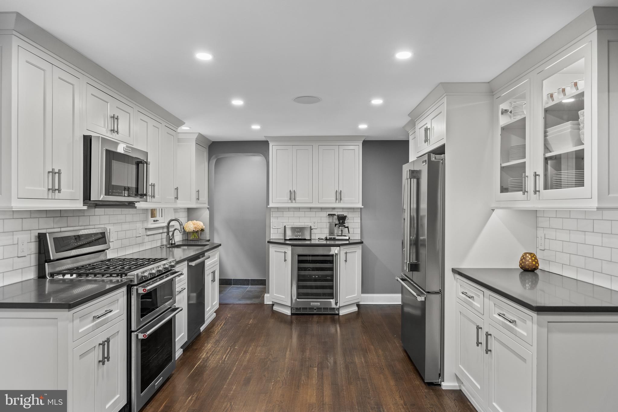 219 West Summit Avenue Haddonfield, NJ 08033 - Photo 6 of 29 a kitchen with stainless steel appliances a stove sink microwave and cabinets