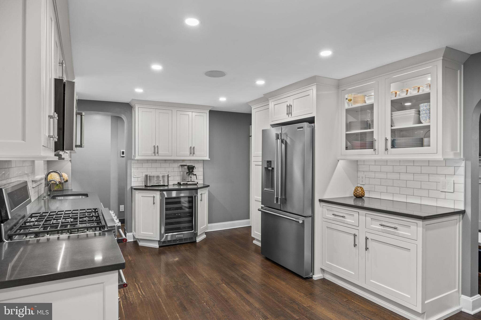 219 West Summit Avenue Haddonfield, NJ 08033 - Photo 7 of 29 a kitchen with stainless steel appliances granite countertop a stove and a refrigerator