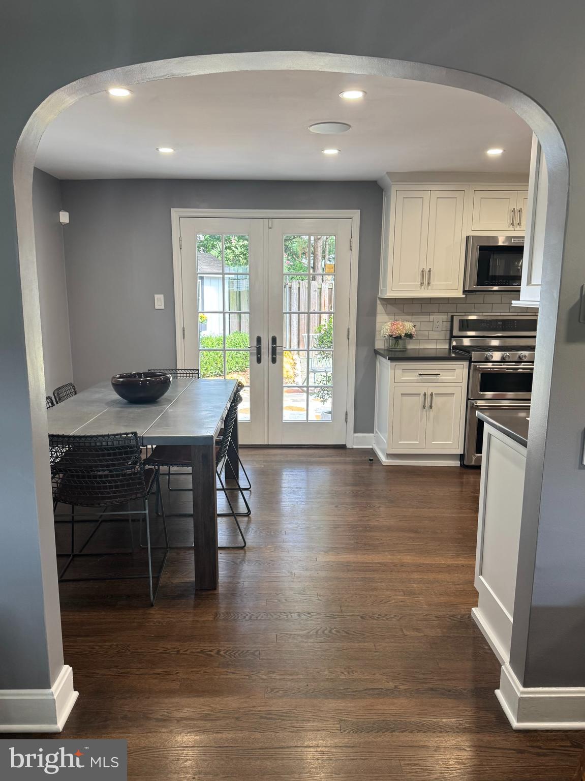 219 West Summit Avenue Haddonfield, NJ 08033 - Photo 10 of 29 a kitchen with a table chairs refrigerator and cabinets