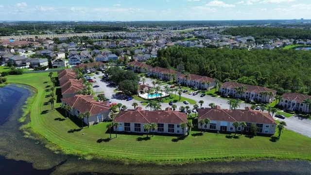 an aerial view of house with yard swimming pool and outdoor seating