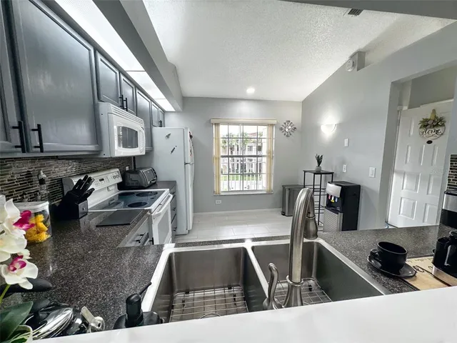a kitchen with lots of counter top space and a window