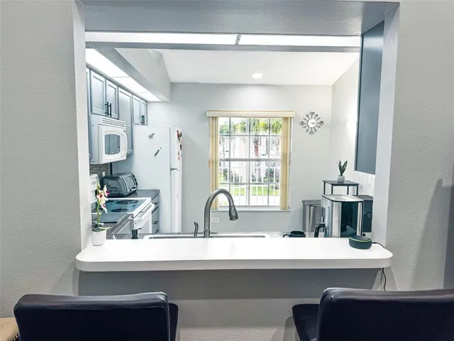 a view of dining room with furniture and window