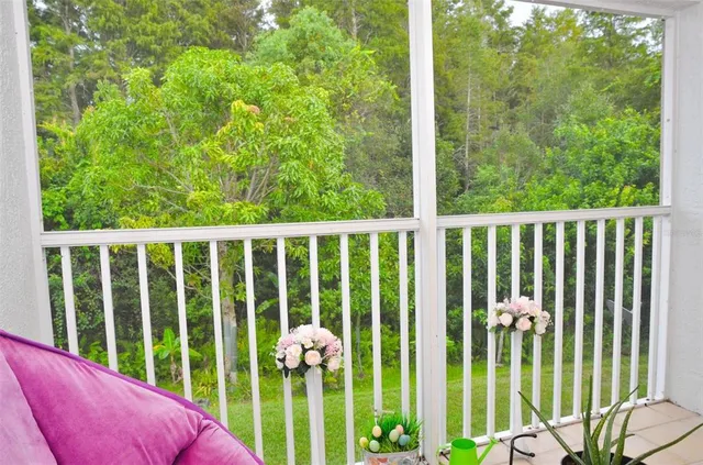 a view of a balcony with plants