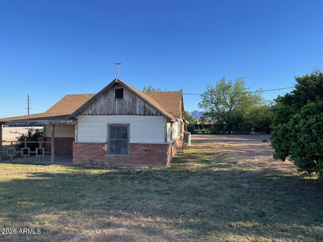 9115 West Broadway Road Tolleson, AZ 85353 - Photo 8 of 13 a view of a house with a yard