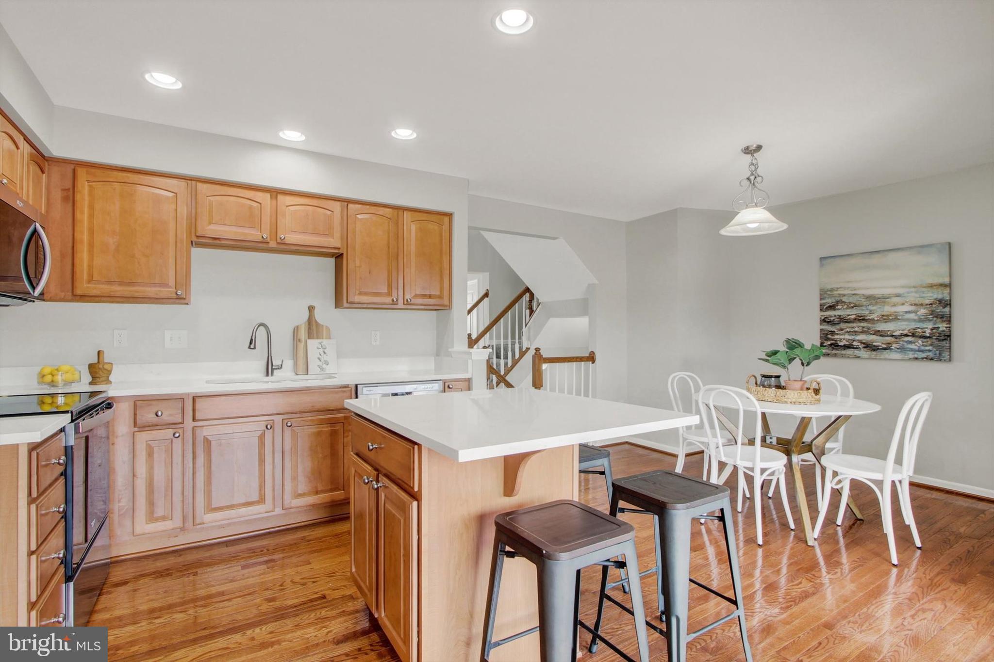 46 Forest View Terrace Hanover, PA 17331 - Photo 11 of 28 a kitchen with a table chairs sink and cabinets
