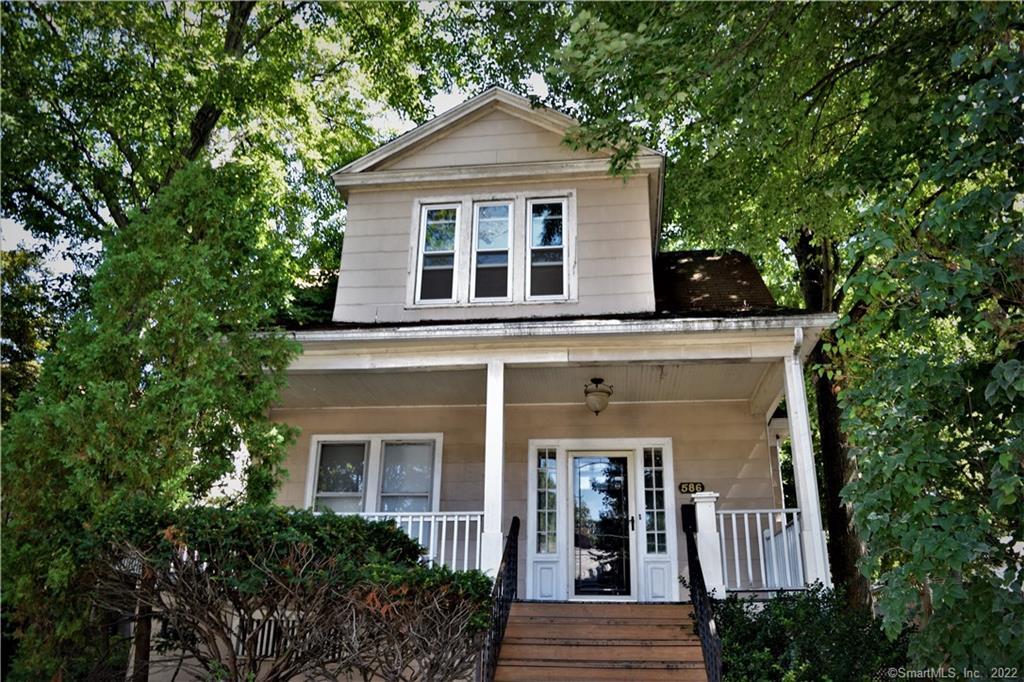 586 Wayne Street Bridgeport, CT 06606 - Photo 1 of 1 front view of a house with a small yard