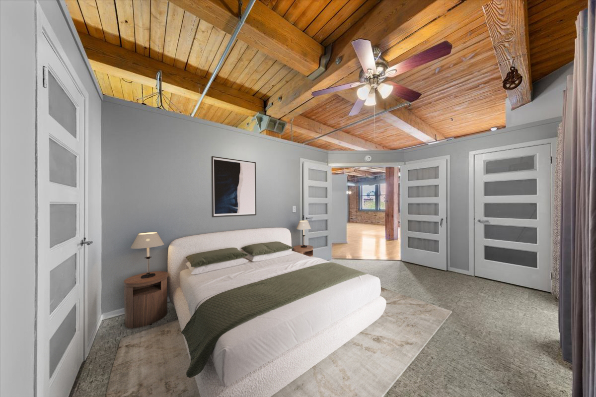 913 West Van Buren Street, Unit 4C Chicago, IL 60607 - Photo 17 of 23 a bedroom with a bed and a flat screen tv