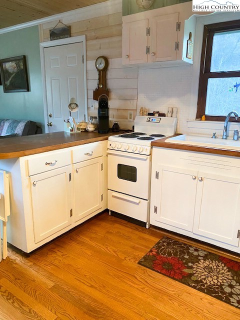 273 Walnut Branch Church Road Sparta, NC 28675 - Photo 12 of 41 a kitchen with granite countertop white cabinets and white appliances
