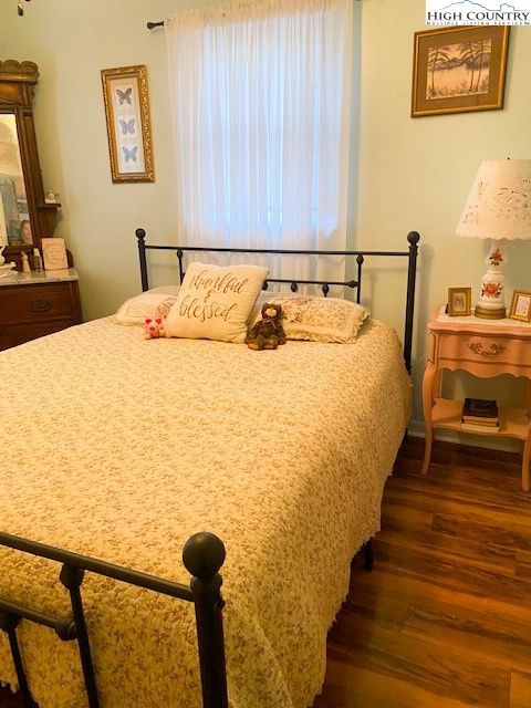 273 Walnut Branch Church Road Sparta, NC 28675 - Photo 21 of 41 a bedroom with bed and wooden floor