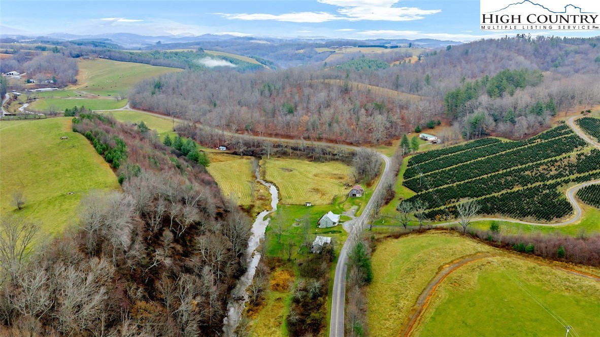 273 Walnut Branch Church Road Sparta, NC 28675 - Photo 34 of 41 a view of a swimming pool with a yard
