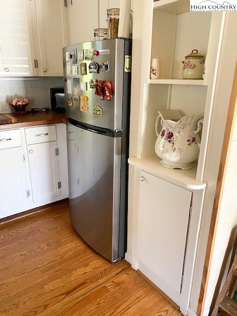 273 Walnut Branch Church Road Sparta, NC 28675 - Photo 5 of 41 a kitchen with a refrigerator and cabinets