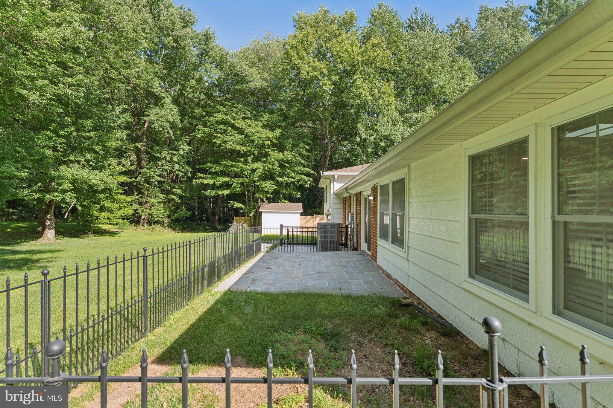 3219 Fox Mill Road Oakton, VA 22124 - Photo 64 of 87 Serene backyard retreat with greenery.