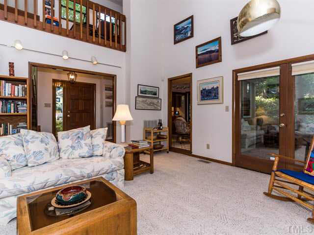 1212 Stone Creek Way Raleigh, NC 27615 - Photo 6 of 25 Another view of the spacious living room with a 2 story ceiling and gorgeous fireplace.