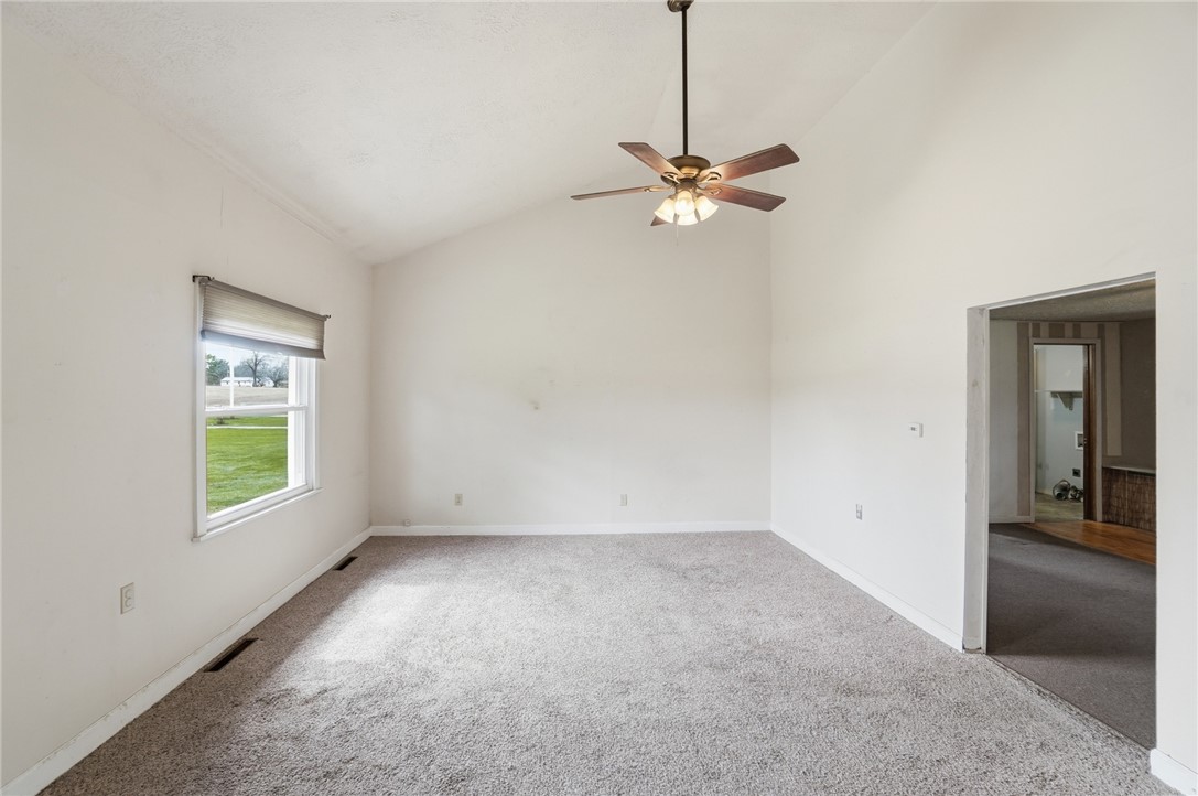 1166 West Sparrow Road Springfield, OH 45502 - Photo 14 of 40 Bright and airy interior with a high vaulted ceiling, ready for your personal touch.