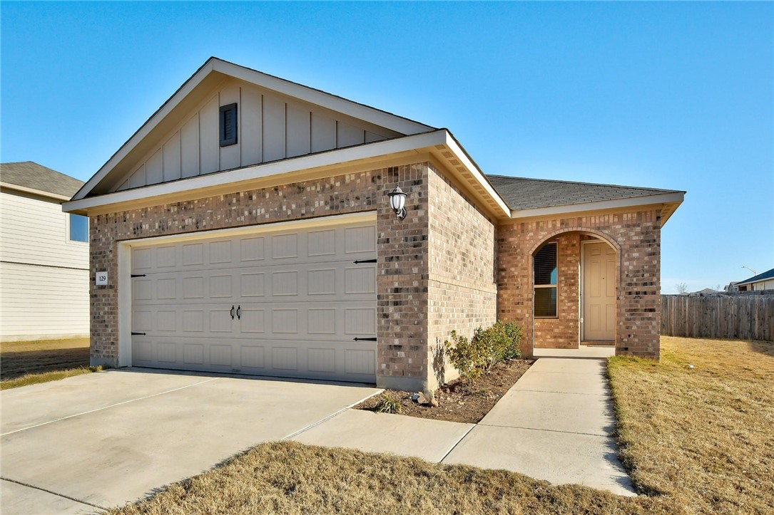 a front view of a house with a garage
