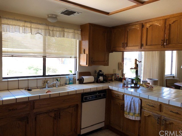 1768 Rambouillet Road Paso Robles, CA 93446 - Photo 16 of 23 Kitchen with view to the roses and golf course greenery.