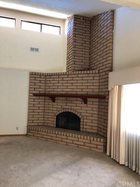 1768 Rambouillet Road Paso Robles, CA 93446 - Photo 7 of 23 Living room fireplace with high ceiling.