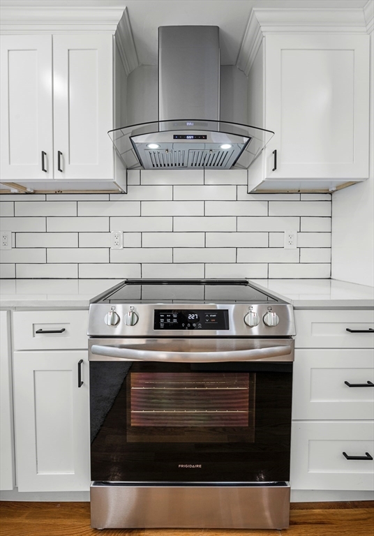 102 Hathaway Circle Arlington, MA 02476 - Photo 11 of 38 a stove top oven sitting inside of a kitchen
