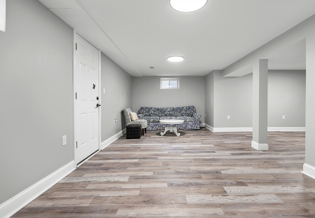 102 Hathaway Circle Arlington, MA 02476 - Photo 18 of 38 a spacious bedroom with a bed and wooden floor