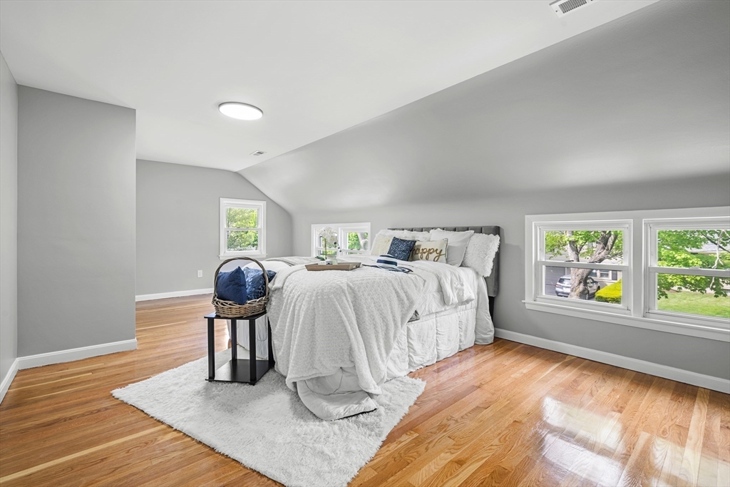 102 Hathaway Circle Arlington, MA 02476 - Photo 19 of 38 a spacious bedroom with a bed and window