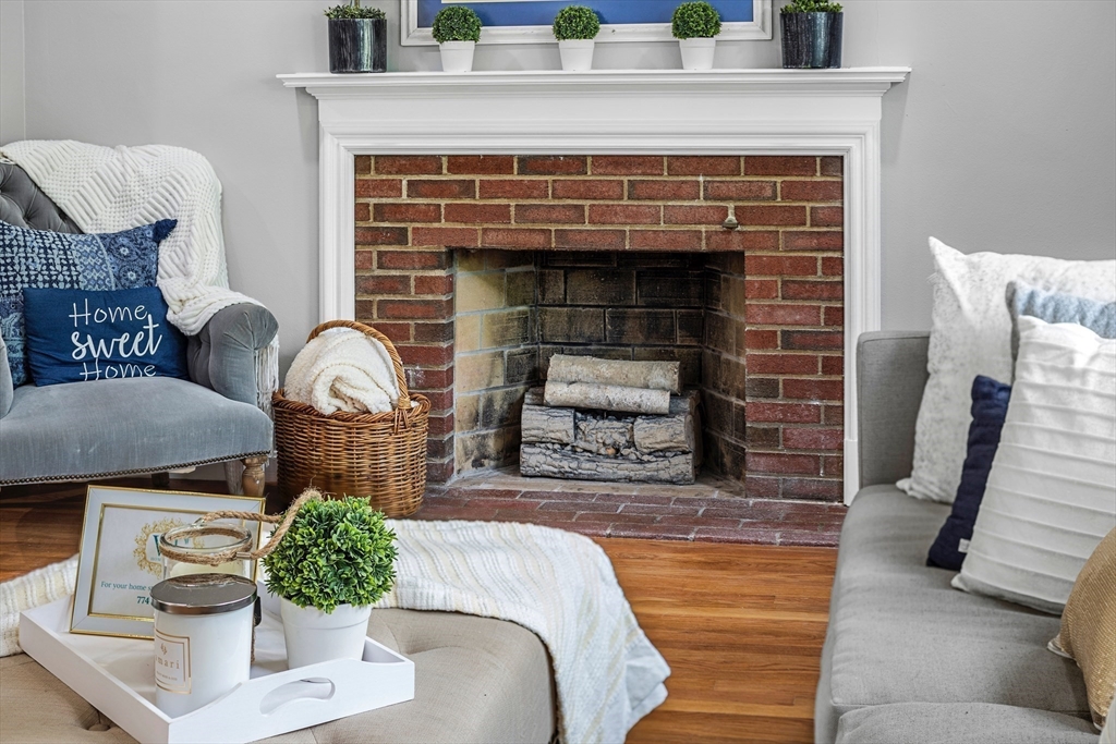 102 Hathaway Circle Arlington, MA 02476 - Photo 20 of 38 a living room with furniture and a fireplace