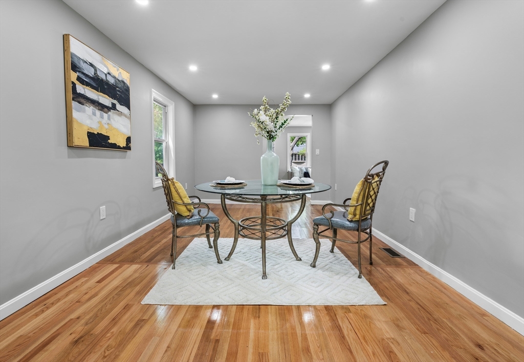 102 Hathaway Circle Arlington, MA 02476 - Photo 21 of 38 a view of a dining room with furniture and wooden floor