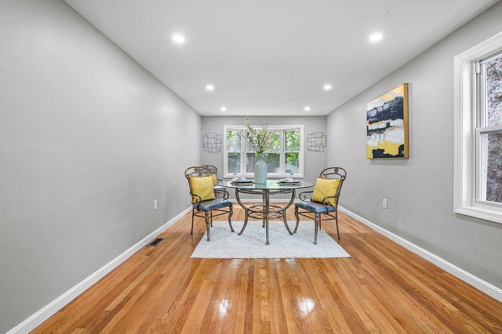 102 Hathaway Circle Arlington, MA 02476 - Photo 27 of 38 a dining room with furniture and wooden floor