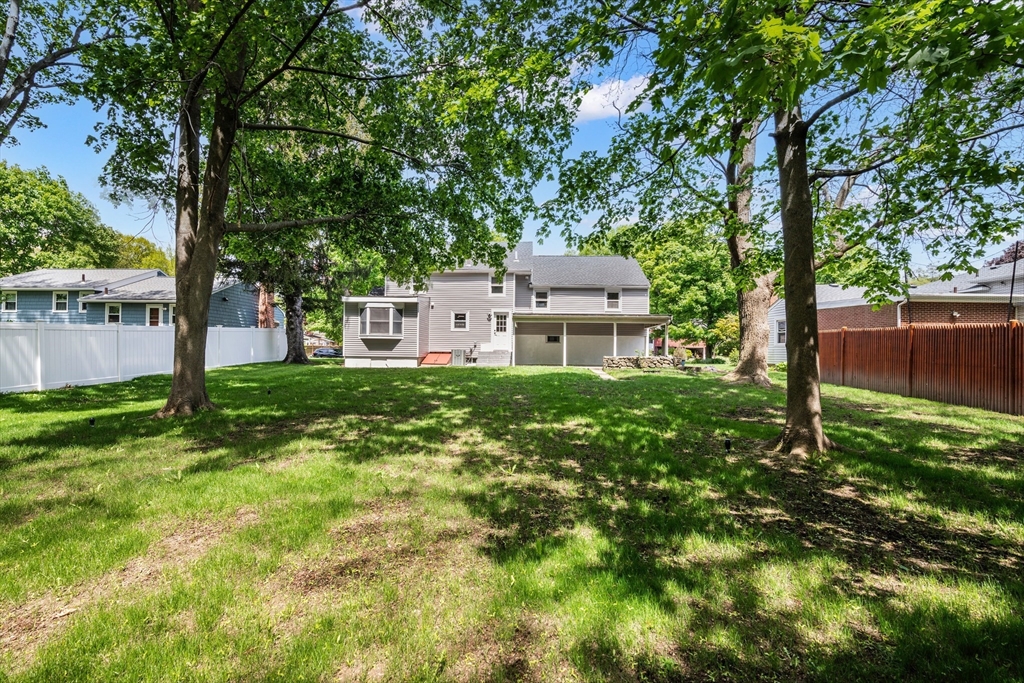 102 Hathaway Circle Arlington, MA 02476 - Photo 35 of 38 a front view of a house with garden