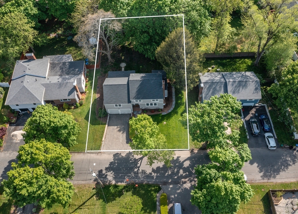 102 Hathaway Circle Arlington, MA 02476 - Photo 5 of 38 an aerial view of a house with a garden