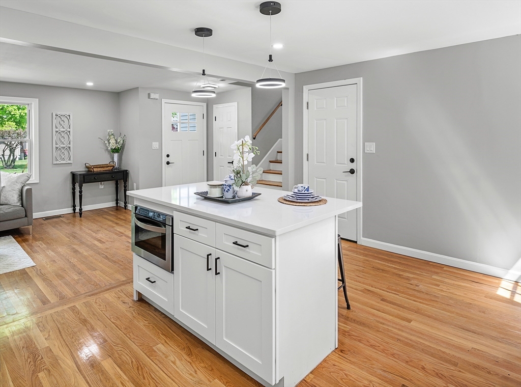 102 Hathaway Circle Arlington, MA 02476 - Photo 10 of 38 a utility room with cabinets washer and dryer