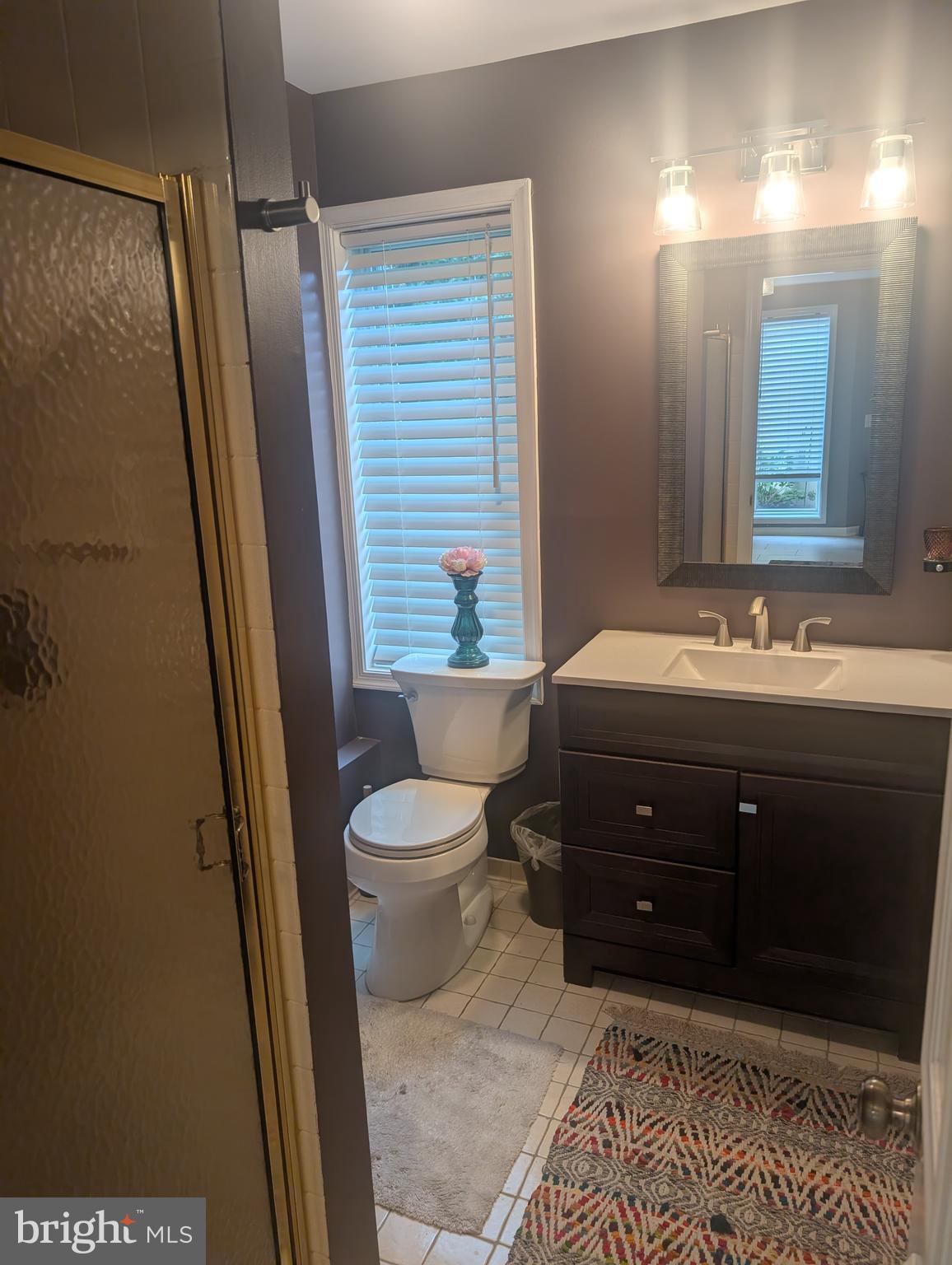 3002 Courtside Road Bowie, MD 20721 - Photo 12 of 48 a bathroom with a sink and a mirror