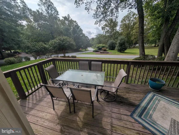 a patio with patio couch and wooden floor