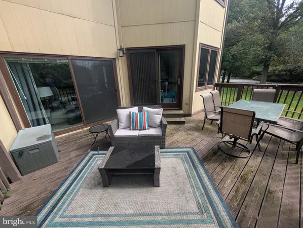 a view of balcony with furniture