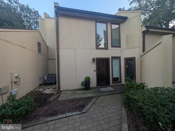 a house with trees in the background