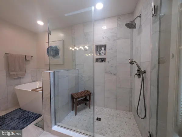 a bathroom with double vanity sink and a mirror