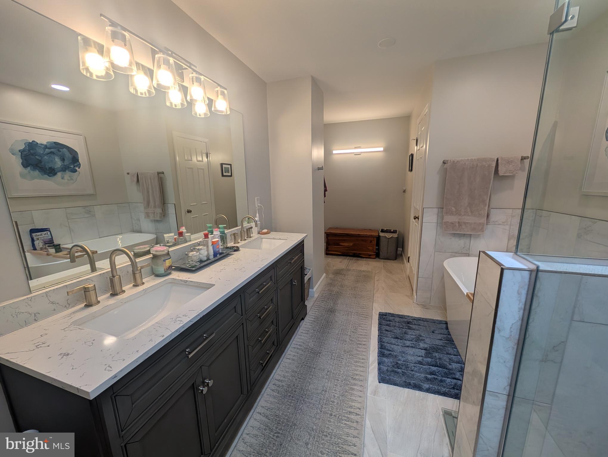 3002 Courtside Road Bowie, MD 20721 - Photo 40 of 48 a bathroom with double vanity sink and a mirror