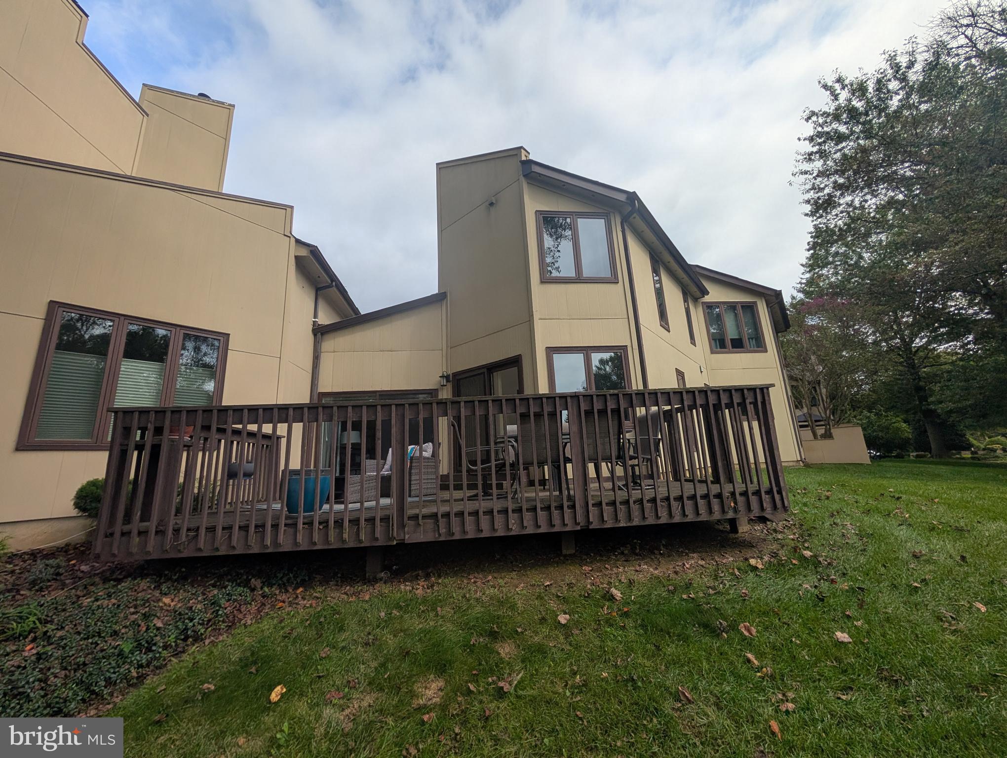 3002 Courtside Road Bowie, MD 20721 - Photo 42 of 48 a view of a house with wooden deck and a yard
