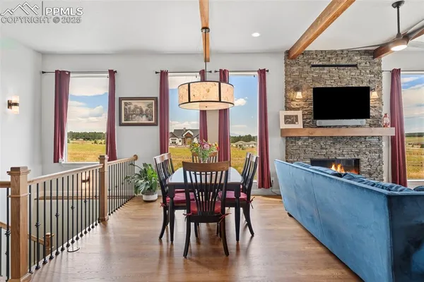 a view of a dining room with furniture window and wooden floor