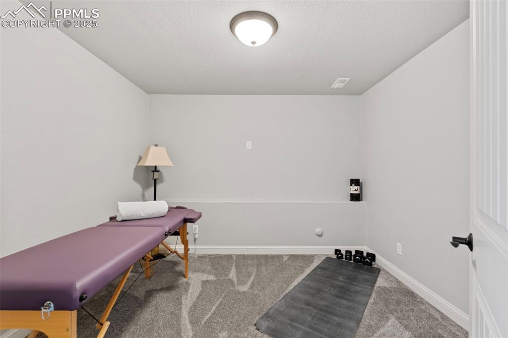 11726 Rambling Road Colorado Springs, CO 80908 - Photo 40 of 50 a bathroom with a tub and sink