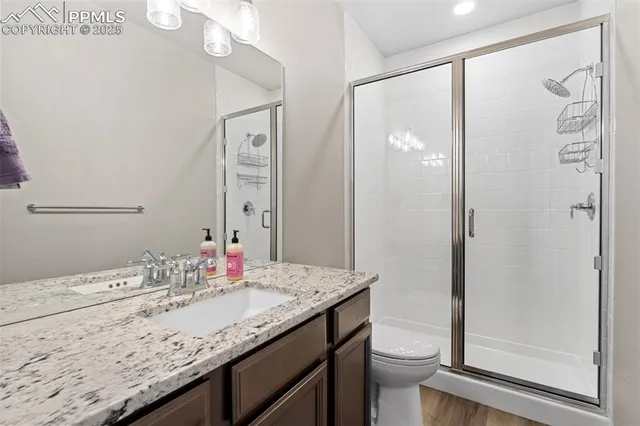 a balcony with furniture and a floor to ceiling window