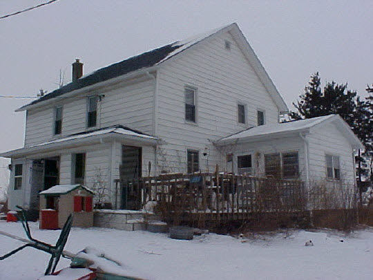 6662 North Columbine Road Forreston, IL 61030 - Photo 1 of 2 a front view of a house with garage