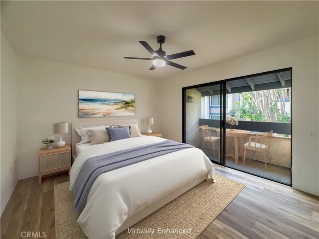 a bedroom with a large bed and a large window