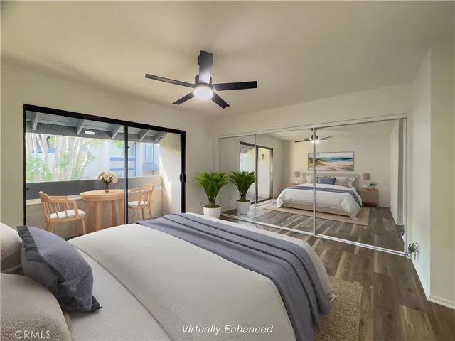 a bedroom with a large bed and a large window