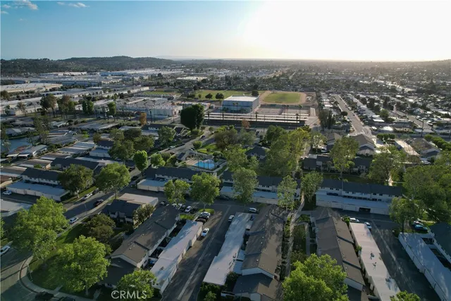 an aerial view of houses with outdoor space
