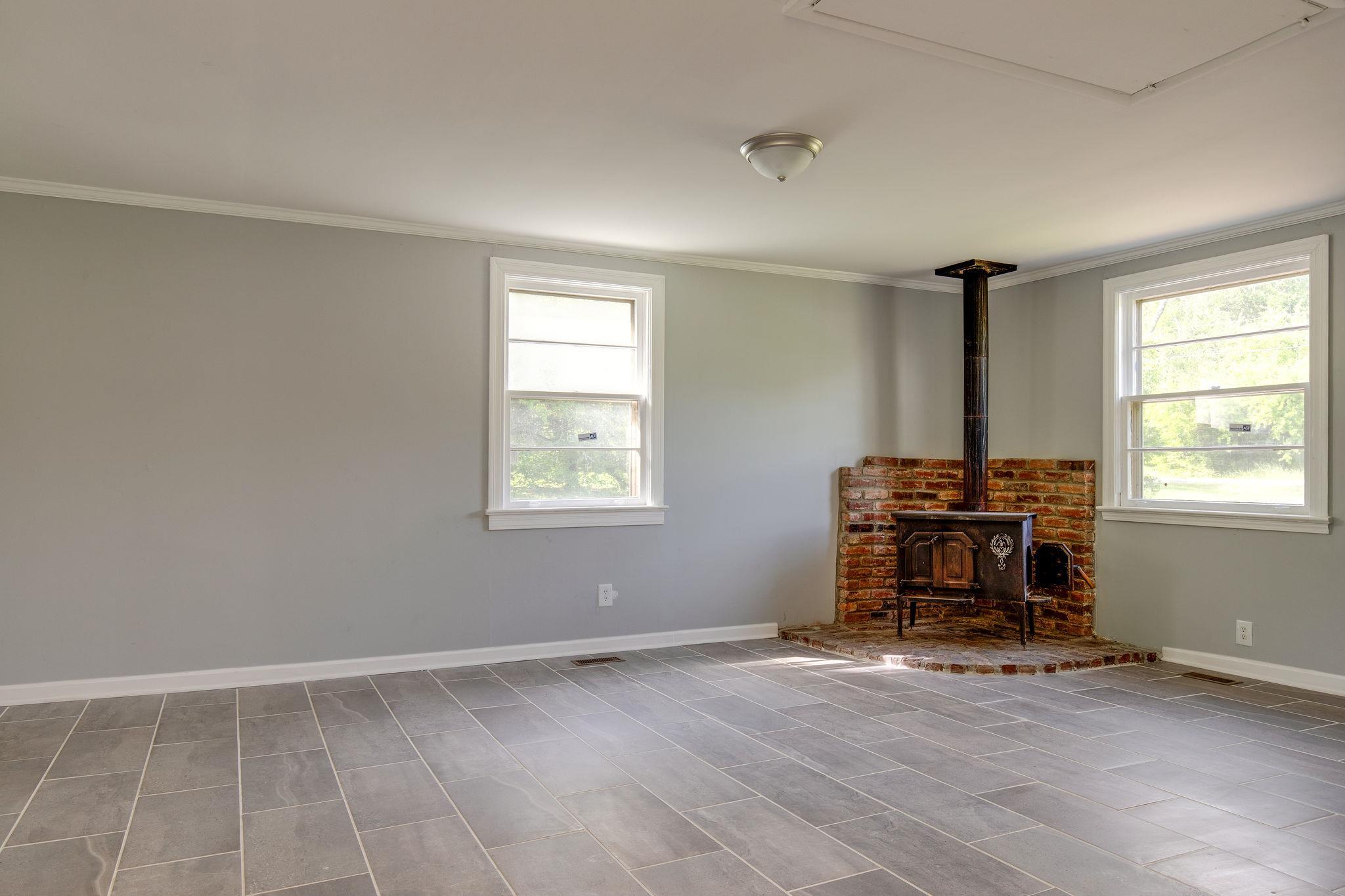 1008 Neelys Bend Road Madison, TN 37115 - Photo 12 of 26 an empty room with furniture and a window