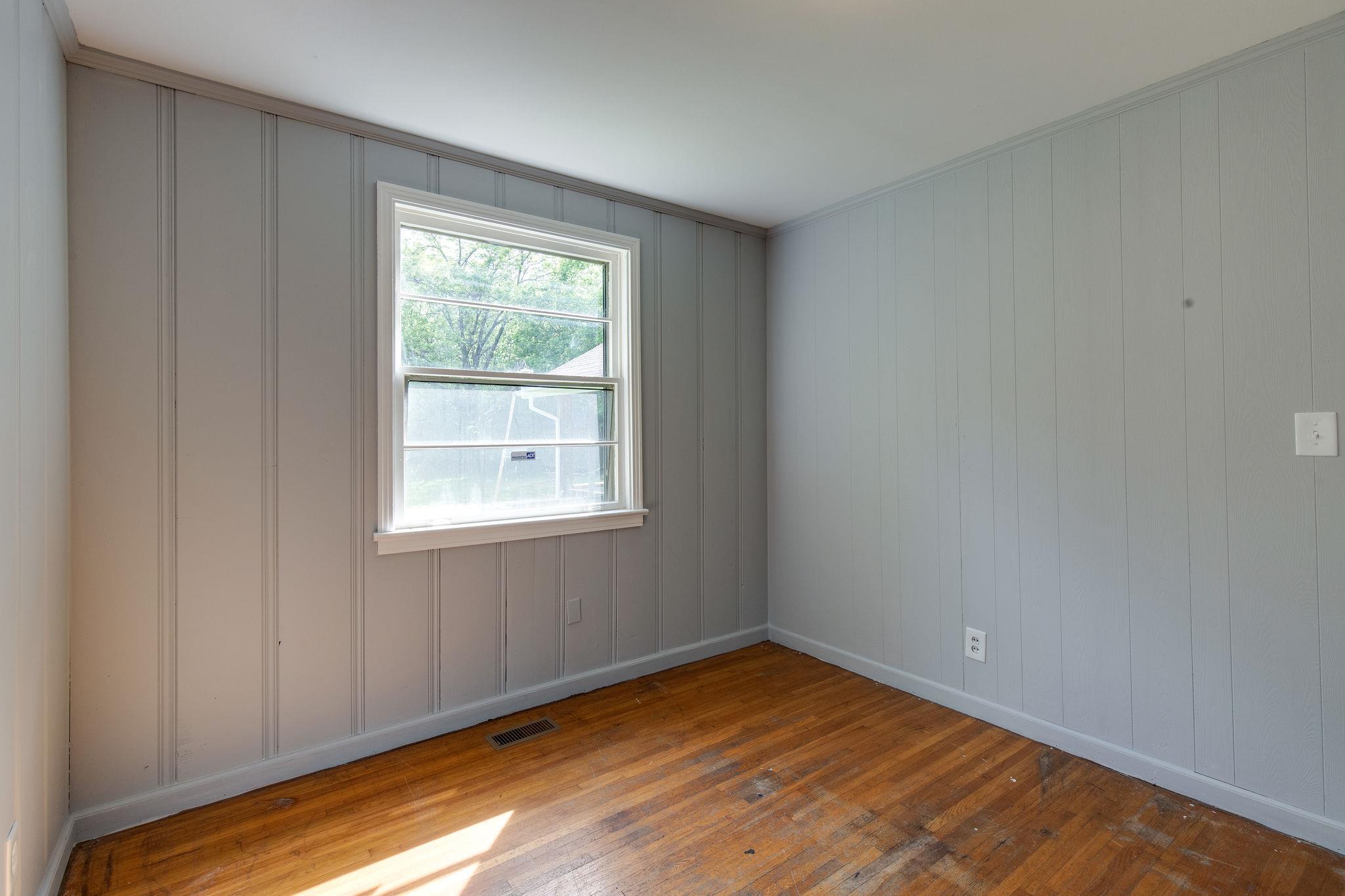 1008 Neelys Bend Road Madison, TN 37115 - Photo 18 of 26 a view of empty room with wooden floor and fan