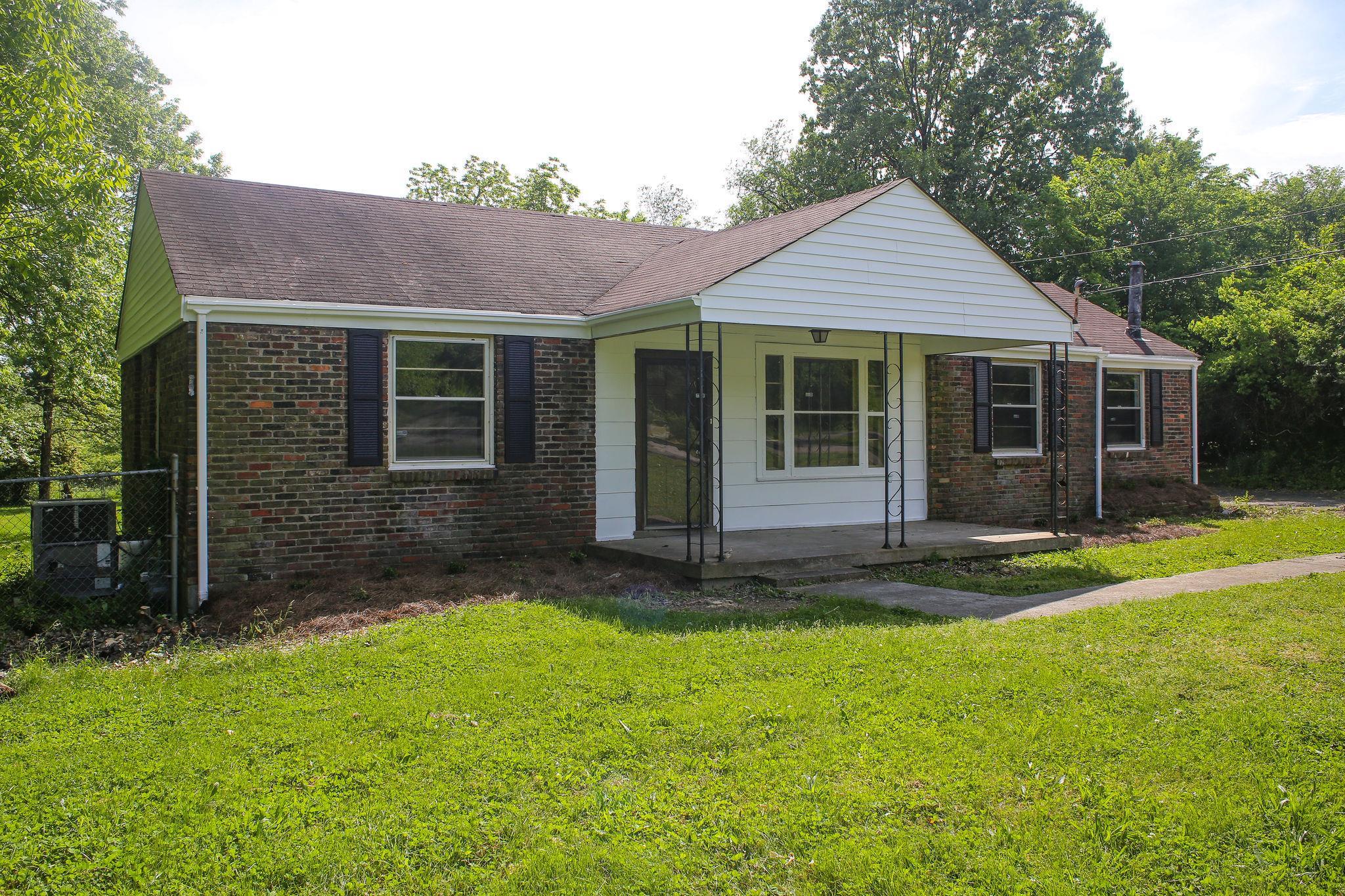 1008 Neelys Bend Road Madison, TN 37115 - Photo 3 of 26 front view of a house with a yard