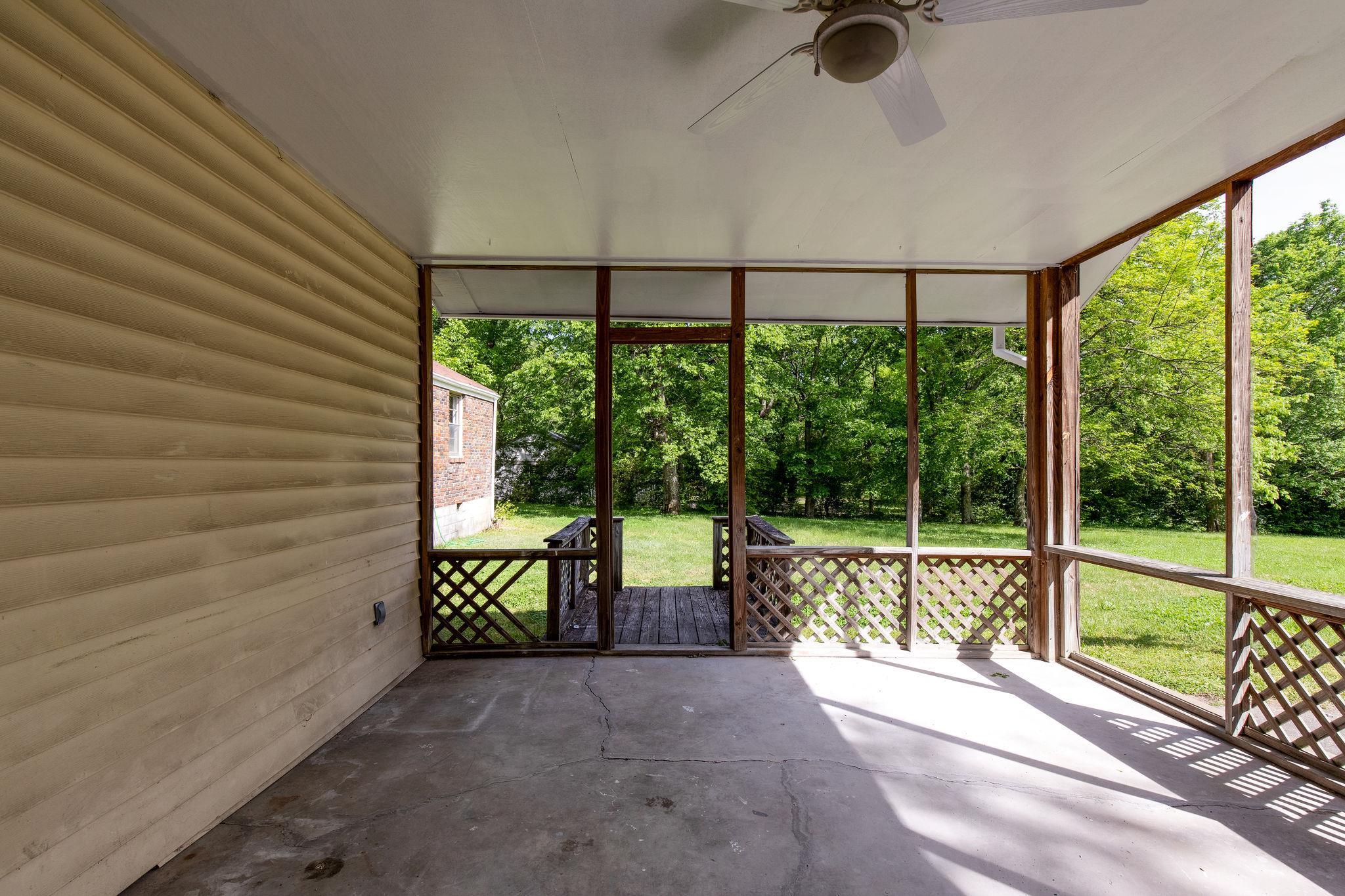 1008 Neelys Bend Road Madison, TN 37115 - Photo 22 of 26 wooden floor in an empty room with a window