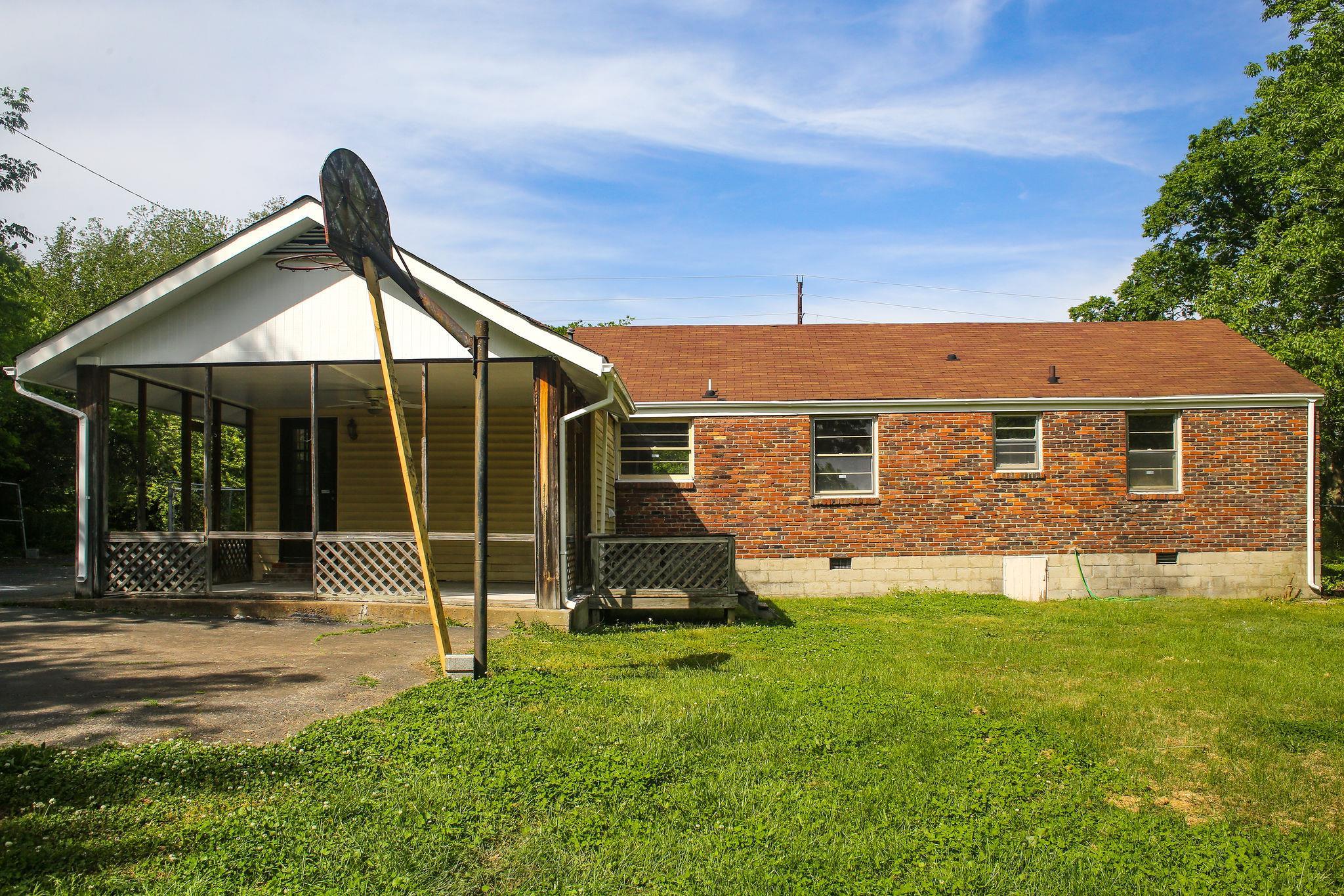 1008 Neelys Bend Road Madison, TN 37115 - Photo 24 of 26 a backyard of a house with plants and garden