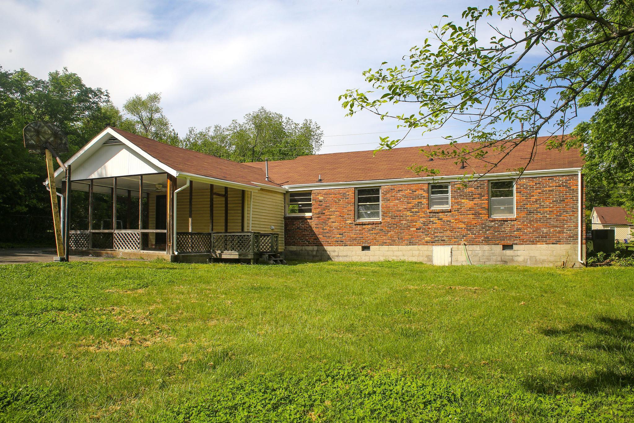 1008 Neelys Bend Road Madison, TN 37115 - Photo 25 of 26 a view of a house with a yard and sitting area